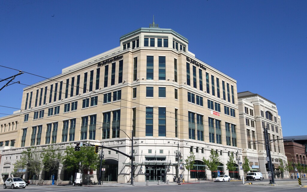 FILE - This April 20, 2016, file photo shows the Salt Lake Tribune in Salt Lake City. The Tribune newsroom takes up one floor of the building that bears its name, overlooking snow-capped mountains and the arena where the Utah Jazz play. Once a Digital First property that dealt with staff reductions and feared closure, the paper was sold to a prominent local family in 2016. Since then, its reporters received their first raise in a decade and won a Pulitzer prize for investigative reporting. (AP Photo/Rick Bowmer, File)