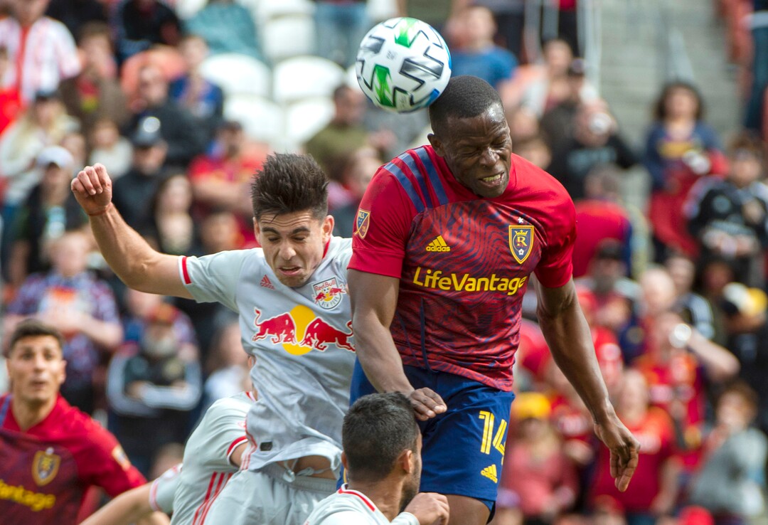 (Rick Egan  |  The Salt Lake Tribune)    New York Red Bulls forward Brian White (42) collides with Real Salt Lake defender Nedum Onuoha (14) as they go for the ball, in MLS acton between Real Salt Lake and the New York Red Bulls at Rio Tinto Stadium, Saturday, March 7, 2020.