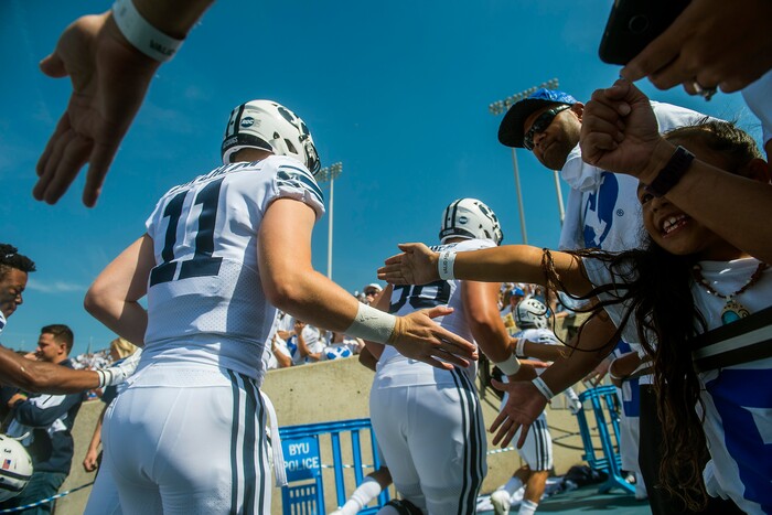 (Chris Detrick  |  The Salt Lake Tribune)   Brigham Young Cougars run off of the field before the game at LaVell Edwards Stadium Saturday Saturday, September 16, 2017. 