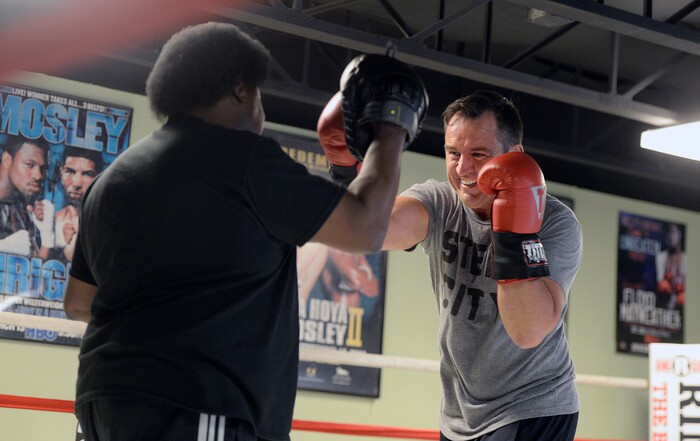 (Al Hartmann | The Salt Lake Tribune)
House Speaker Greg Hughes spars with Eddie "Flash" Newman during his workout at the Flash Academy gym in Holladay Tuesday August 29. He's among a handful of local politicians, police and lobbyists who will box in a series of charity matches to benefit a national group that works to end domestic violence.