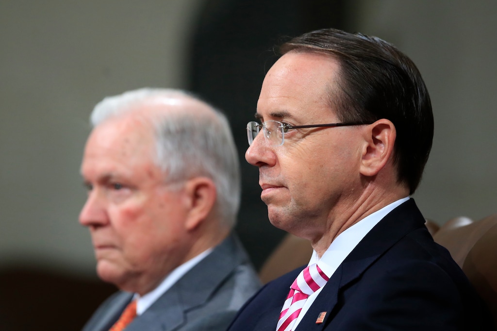 Attorney General Jeff Sessions, left, and Deputy Attorney General Rod Rosenstein, listen to remarks during a Religious Liberty Summit at the Department of Justice, Monday, July 30, 2018. (AP Photo/Manuel Balce Ceneta)