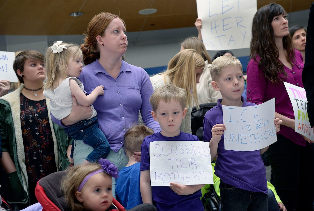 (Al Hartmann  |  The Salt Lake Tribune)  Mormon women and other concerned citizens gather at the Salt Lake City Airport in a show of solidarity for an area woman, Isabel, who has been ordered to leave the United States by ICE agents. 
ICE  escorted her onto a flight bound for Columbia. Isabel is a single mother and is the sole caretaker for her disabled son and her 86-year-old mother.