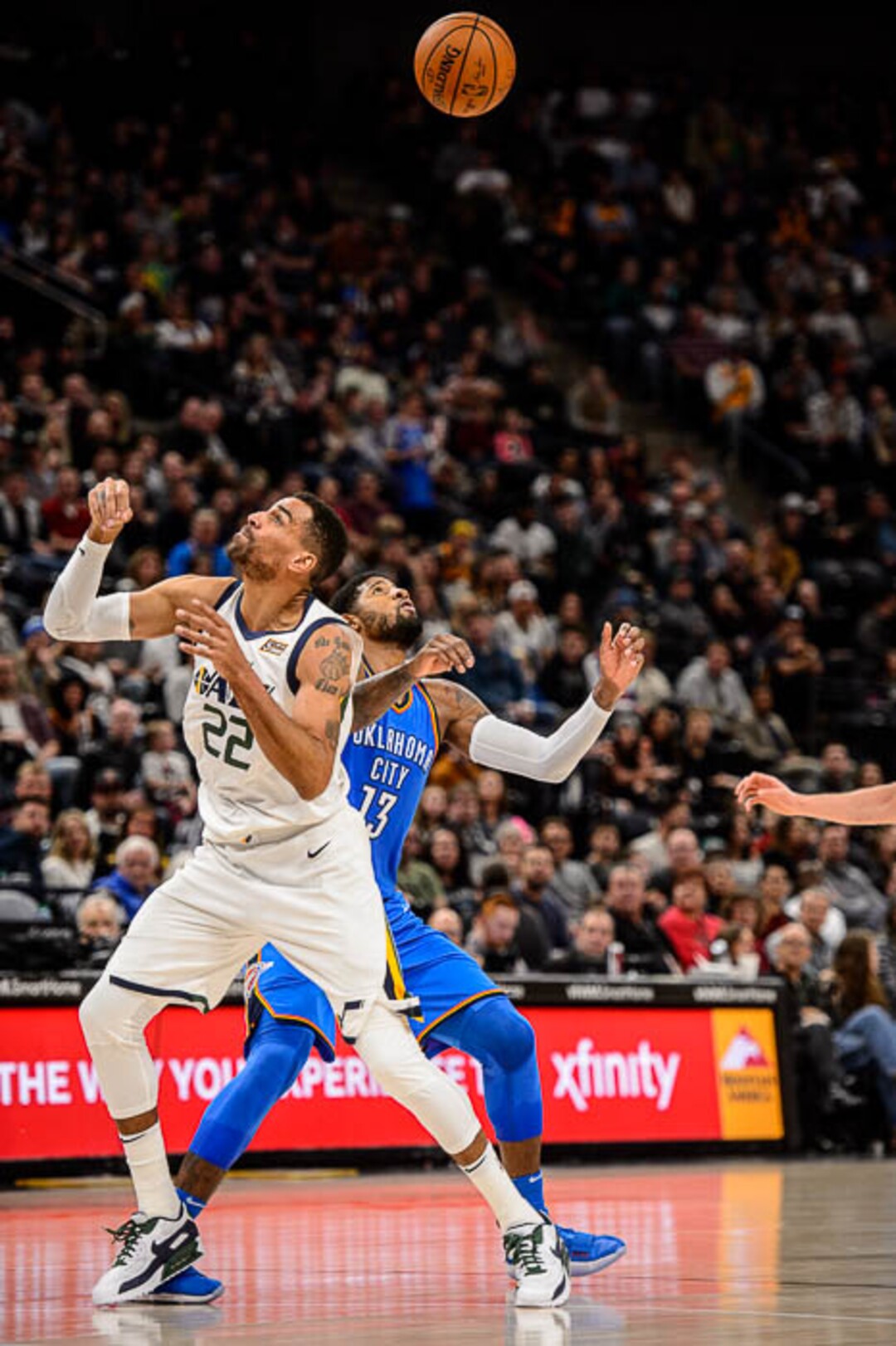 (Trent Nelson | The Salt Lake Tribune)  Utah Jazz forward Thabo Sefolosha (22) and Oklahoma City Thunder forward Paul George (13) look for the ball as the Utah Jazz host the Oklahoma City Thunder, NBA basketball in Salt Lake City, Saturday December 23, 2017.