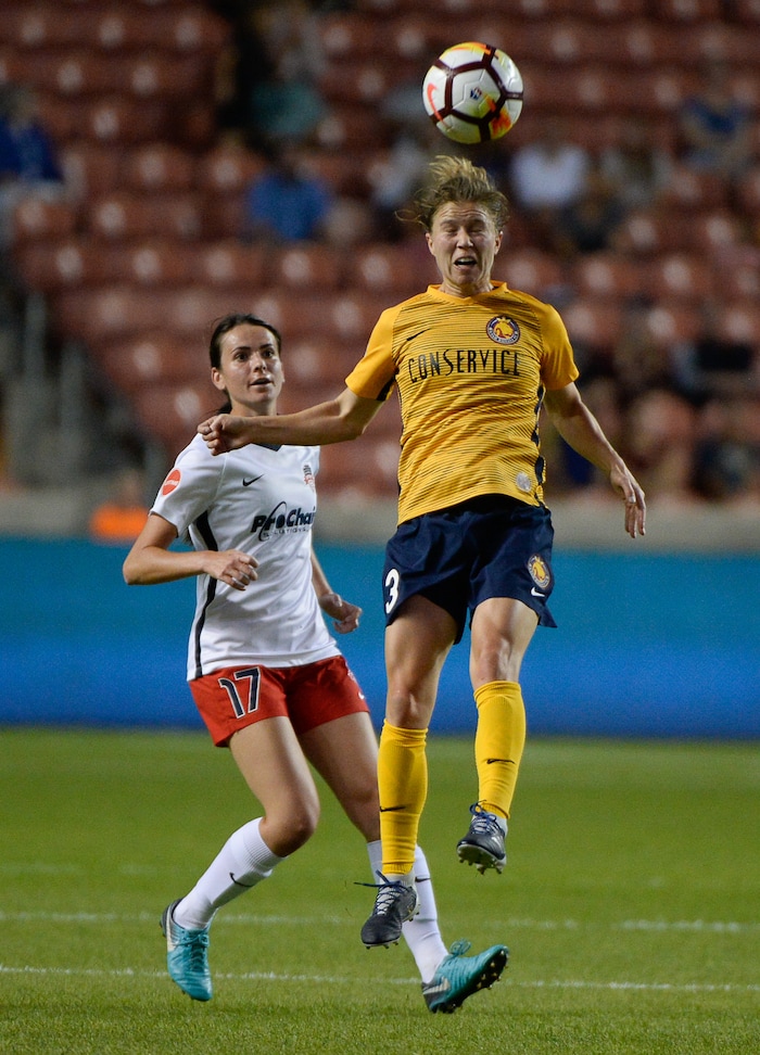 (Francisco Kjolseth  |  The Salt Lake Tribune)  Utah Royals FC hosts Washington Spirit, NWSL soccer at Rio Tinto Stadium in Sandy, Wed. Aug. 8, 2018. Utah Royals FC defender Becca Moros (3) goes up for a header ahead of Washington Spirit forward Cali Farquharson (17). 