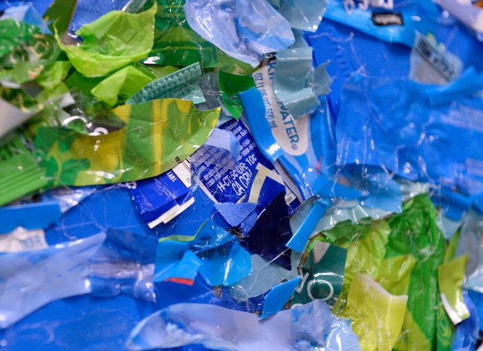 (Leah Hogsten  |  The Salt Lake Tribune) Students at Parkview Elementary have created a treasure with trash. Ten fifth graders in Cher Sten’s extended learning program or ELP class, molded school and household plastic refuse into a mosaic to send the message— “Consume Less” to their classmates. The idea for the mural began after a discussion about global warming, climate issues, plastic pollution and its implications on earth.