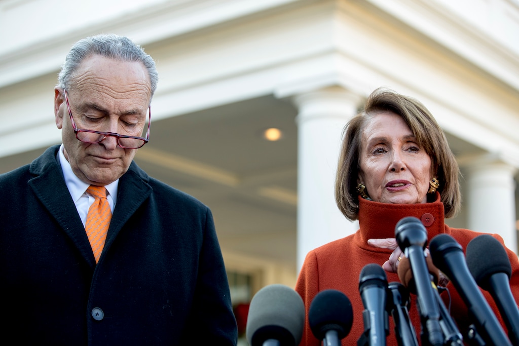 House Minority Leader Nancy Pelosi of Calif., right, accompanied by Senate Minority Leader Sen. Chuck Schumer of N.Y., left, speaks to members of the media outside the West Wing of the White House in Washington, Tuesday, Dec. 11, 2018, following a meeting with President Donald Trump. (AP Photo/Andrew Harnik)