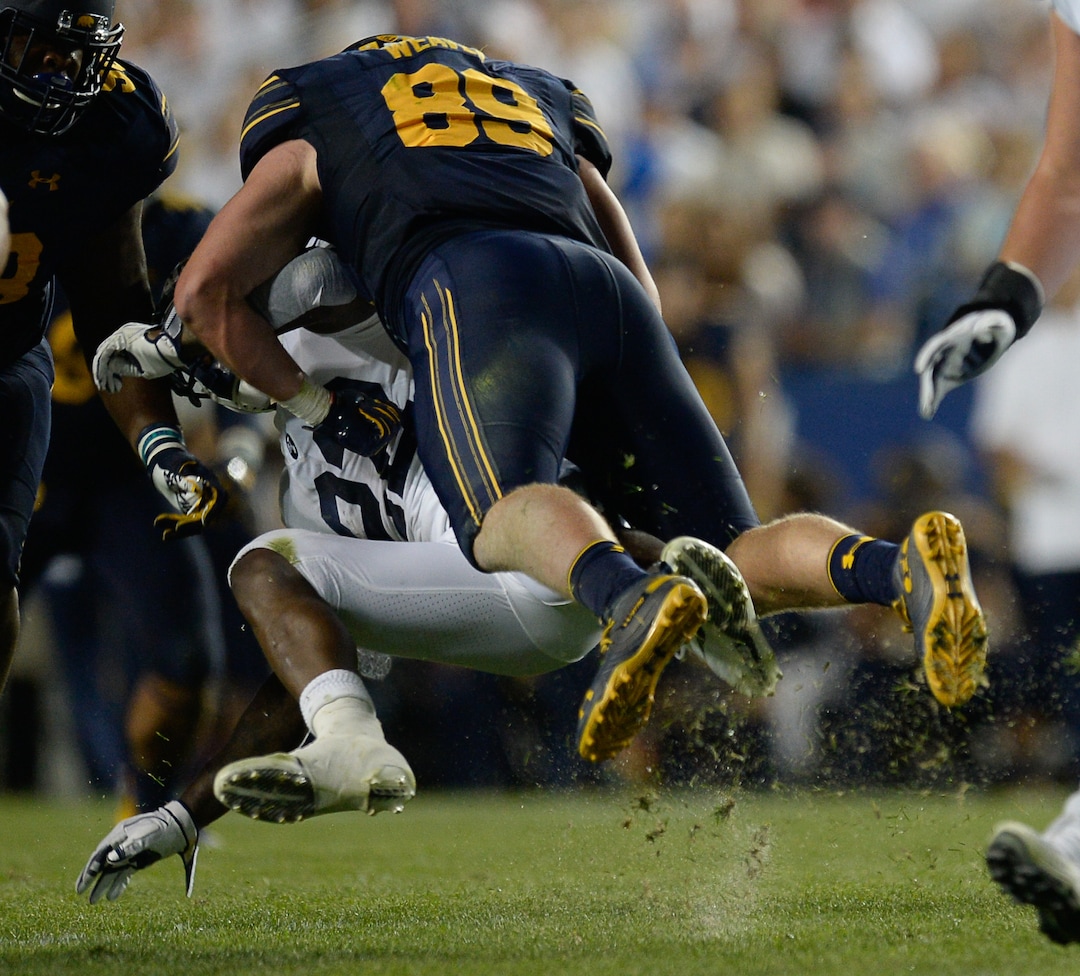 (Francisco Kjolseth  |  The Salt Lake Tribune)  Brigham Young Cougars running back Squally Canada (22) misses a pass as California Golden Bears linebacker Evan Weaver (89) delivers a hard tackle during the first half of the NCAA college football game, Saturday, Sept. 8, 2018, at LaVell Edwards stadium in Provo, Utah.