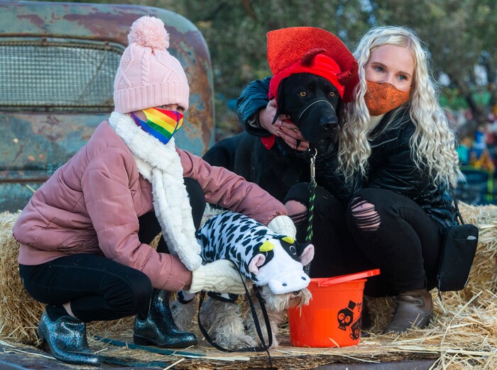 (Rick Egan  |  The Salt Lake Tribune)      Clair Call poses for a photo with her dog, Cooper, and Chloe Call with Fizz, during the "Dog Days in the Maze", at Wheeler Farm, Monday, Oct. 26, 2020.