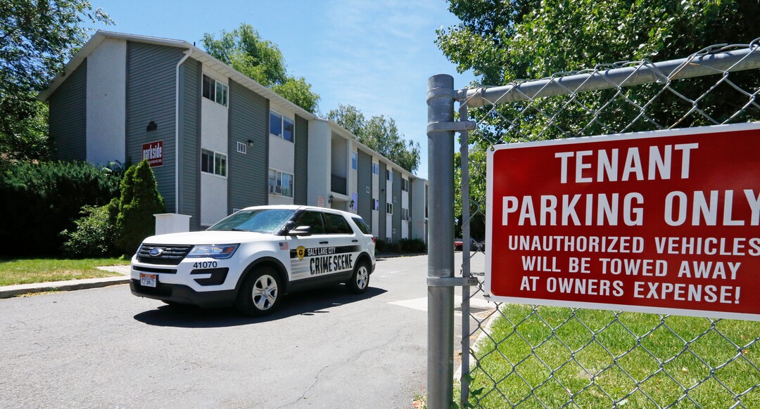 A Salt Lake City Police crime scene vehicle leaves the parking lot after collecting evidence  from an apartment complex where Ayoola A. Ajayi was taken into custody in connection with missing University of Utah student Mackenzie Lueck, Friday, June 28, 2019, in Salt Lake City.  Salt Lake City Police Chief Mike Brown said, Friday that Ajayi was being charged with aggravated murder, kidnapping and desecration of a body in the death of 23-year-old student. (AP Photo/Rick Bowmer)