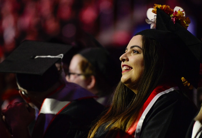 (Francisco Kjolseth  |  The Salt Lake Tribune)  Chiara Padilla who's family immigrated from Uruguay, decorated her mortar board with the words "the first but not the last," becoming the first university graduate in her family as she attends the University of Utah commencement ceremonies on Thursday, May 3, 2018, at the Jon M. Huntsman Center.