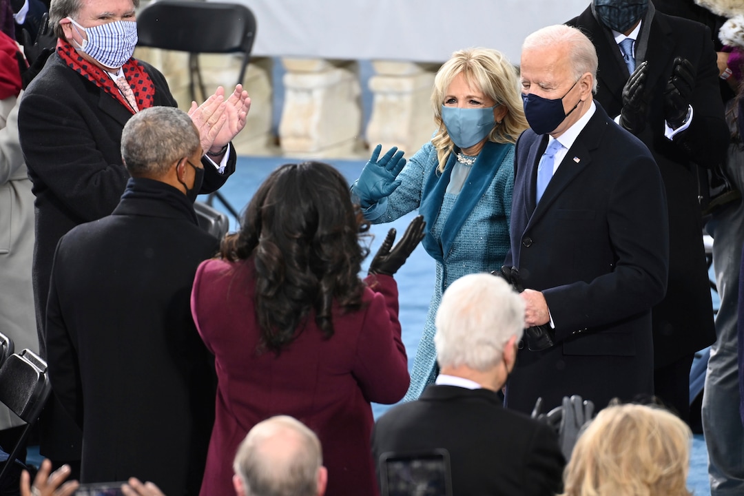 President-elect Joe Biden and his wife Jill Biden are welcomed by former President Barack Obama and his wife Michelle Obama as they arrive for the 59th Presidential Inauguration at the U.S. Capitol for Biden in Washington, Wednesday, Jan. 20, 2021. (Saul Loeb/Pool Photo via AP)
