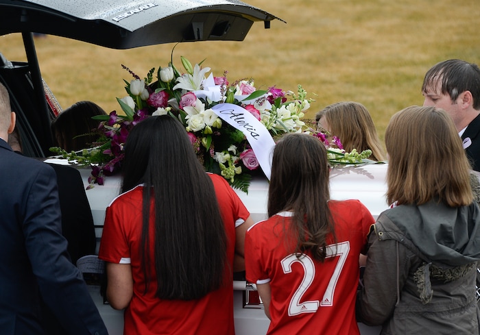 (Francisco Kjolseth  |  The Salt Lake Tribune) Pallbearers load the casket belonging to Alexis Haynie, 15, as funeral services are held for Consuelo Alejandra Haynie and her children Milan, 12, Alexis, 15 and Matthews, 14, in Grantsville on Friday, Jan. 24, 2020. The killing of the Utah mother and three of her children by a gunman identified by police as her 16-year-old son is "nearly unbearable" for the father who survived, a lawyer said Thursday, Jan. 23, 2020.