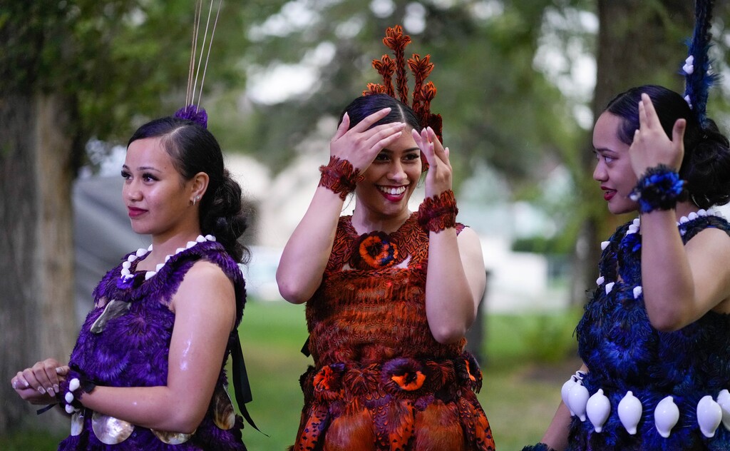 (Francisco Kjolseth | The Salt Lake Tribune) Rain falls as members of Denise’s Polynesian Creations group get ready to take the stage during the Friendly Island Tongan Festival at Jordan Park on Thursday, Aug. 11, 2022. 