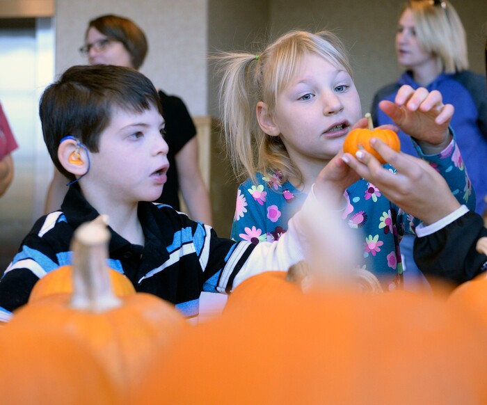 (Al Hartmann | The Salt Lake Tribune)
Rhett Taylor and Gwen Simons, students at Kauri Sue Hamilton School in Riverton pick a favorite pumpkin grown by inmates in the Green Thumb Nursery program at Utah State Prison. Thousands of pumpkins were harvested this season for donation to local children with significant disabilities.