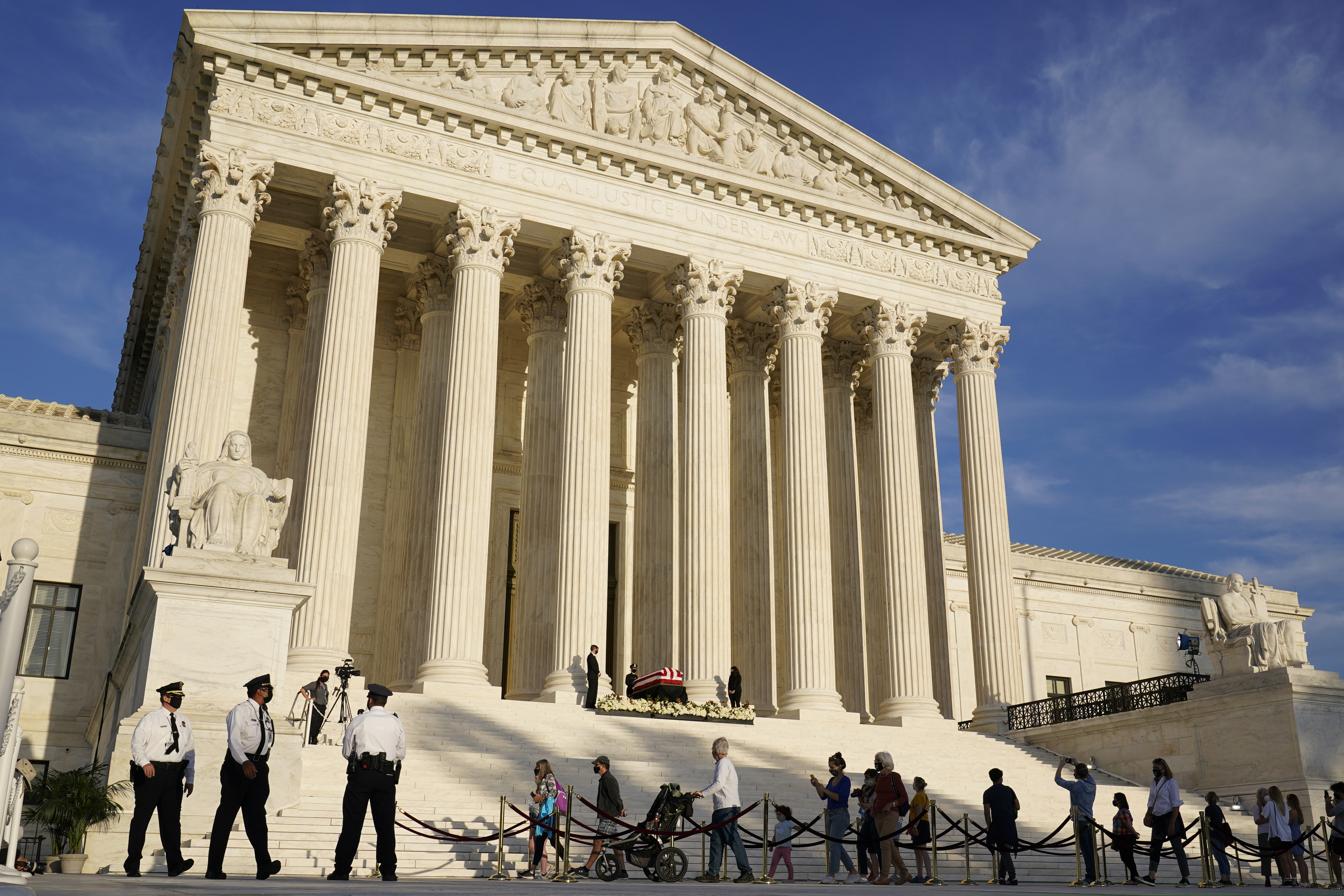 (Susan Walsh | AP file photo) People line up to pay respects as Justice Ruth Bader Ginsburg lies in repose under the Portico at the top of the front steps of the U.S. Supreme Court building on Sept. 23, 2020. Utah Sen. Mitt Romney has joined a group of Republican senators seeking to use a constitutional amendment to keep the number of justices at nine.