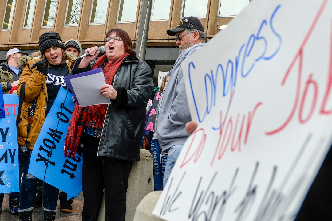 Leah Hogsten  |  The Salt Lake Tribune  Shelly Carver, treasurer with the National Treasury Employees Union Chapter 67 for Internal Revenue Service employees in Ogden, rallies in protest of the ongoing partial federal shutdown outside the Federal Building in Ogden, Jan. 10, 2019.