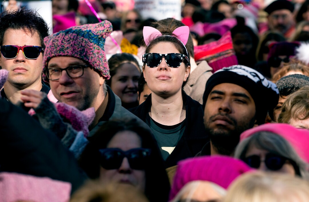 People stand quietly during a moment of silence as they take part in a rally and march highlighting equal rights and equality for women Saturday, Jan. 20, 2018, in New York. The New York protest was among more than 200 such actions planned for the weekend around the world.  (AP Photo/Craig Ruttle)