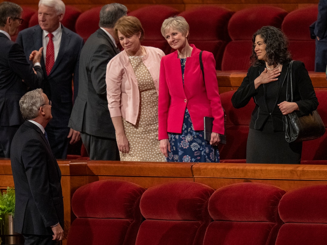 (Rick Egan | The Salt Lake Tribune)  The outgoing Relief Society general presidency of Sharon Eubank, left, Jean B. Bingham and Reyna Aburto, visits with general authorities after the afternoon session of LDS General Conference on Saturday, April 2, 2022.
