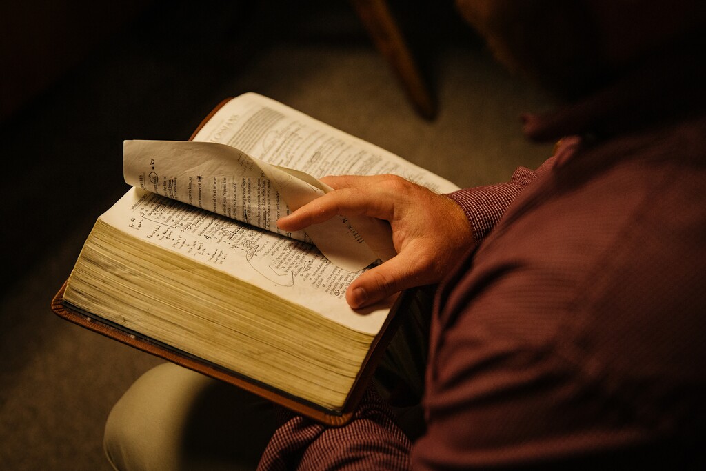 (Terra Fondriest | The New York Times)
A congregant thumbs through a Bible in Perryville, Ark., June 8, 2021. The leaders of the Southern Baptist Convention betrayed their stated beliefs and sacred creeds when they covered up widespread sexual abuse in their denomination and often intimated and belittled victims, writes the New York Times columnist David Brooks.