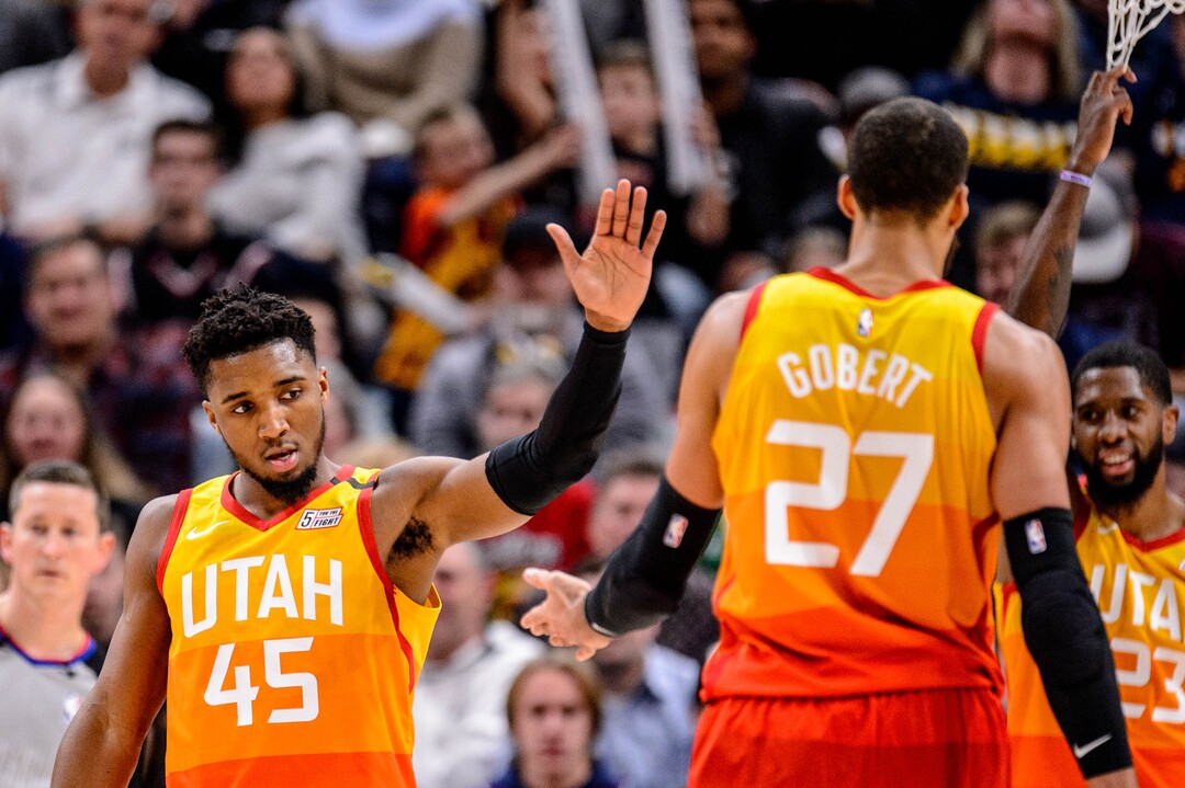 (Trent Nelson  |  The Salt Lake Tribune) Utah Jazz guard Donovan Mitchell (45) high-fives Utah Jazz center Rudy Gobert (27) as the Utah Jazz host the Charlotte Hornets, NBA basketball in Salt Lake City on Friday, Jan. 10, 2020.
