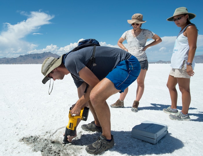 (Rick Egan  |  The Salt Lake Tribune) University of Utah graduate student Jeremiah Bernau cuts a sample of salt crust along with Emily Kam, Hannah Stimson, while doing research with University of Utah professor Brenda Bowen on the effects human of activity  on the salt crust. Thursday, August 10, 2017.

 

