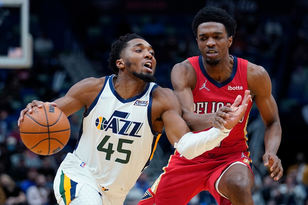 Utah Jazz guard Donovan Mitchell (45) drives to the basket against New Orleans Pelicans forward Herbert Jones in the second half of an NBA basketball game in New Orleans, Monday, Jan. 3, 2022. The Jazz won 115-104. (AP Photo/Gerald Herbert)