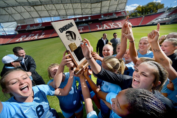 (Scott Sommerdorf | The Salt Lake Tribune)
Sky View players celebrate wit the 4A trophy after Sky View defeated Bonneville 2-0 to win the 4A title game, Saturday, October 21, 2017.