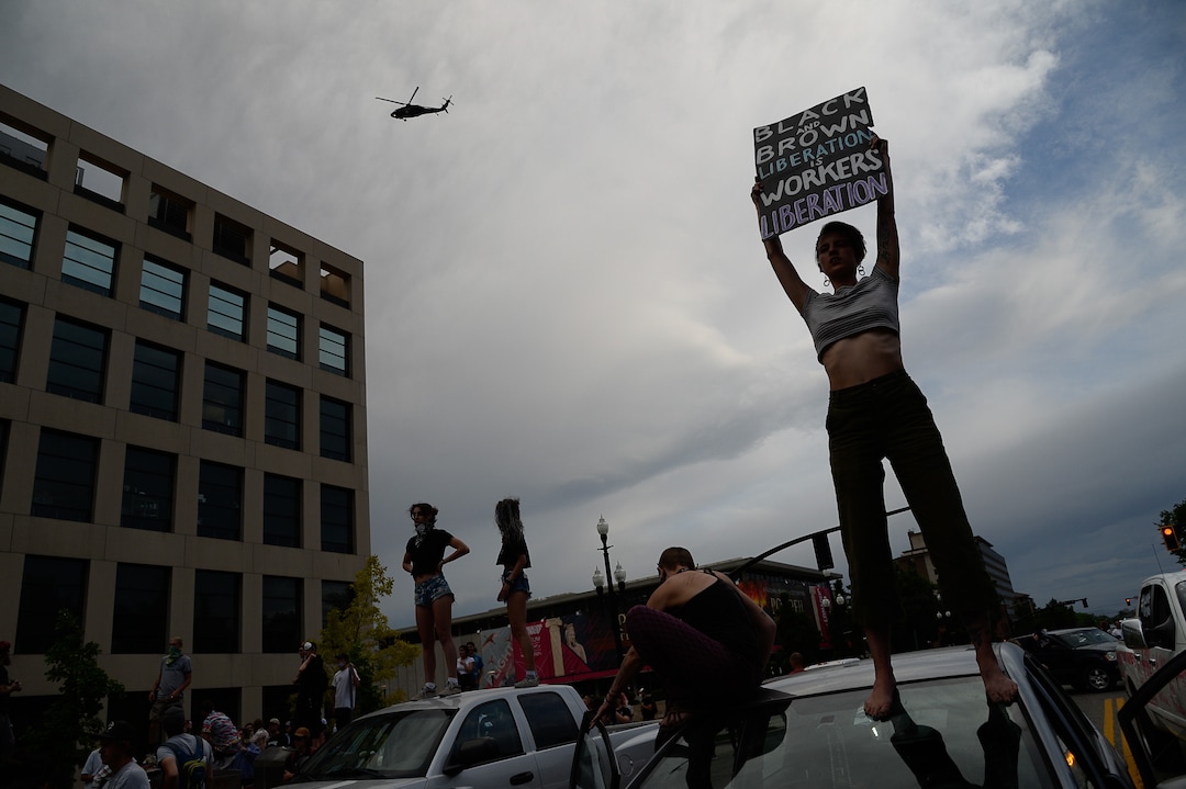 (Francisco Kjolseth  |  The Salt Lake Tribune) Protesters were met by a large police presence on Saturday, May 30, 2020.