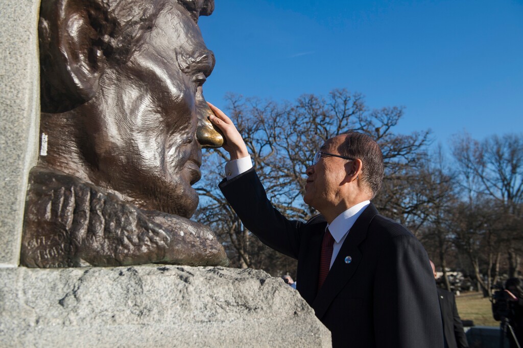 In this Dec. 21, 2016 photo provided by the United Nations, U.N. Secretary-General Ban Ki-moon rubs the nose on the statue of former U.S. President Abraham Lincoln during a visit to Abraham Lincoln Presidential Library and Museum in Springfield, Ill. "Lincoln was a heroic force for equality, integration and reconciliation; and desperately, we need that spirit today," Ban said of the U.S. leader during America's Civil War. (Amanda Voisard/The United Nations via AP)