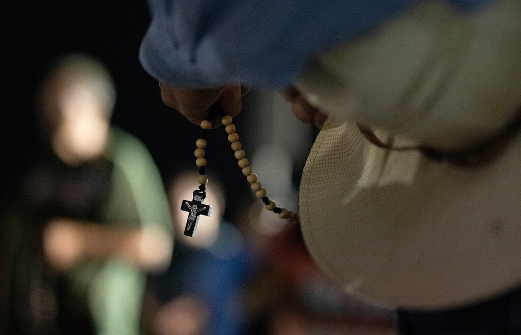 (Francisco Kjolseth | The Salt Lake Tribune) People recite the rosary as they gather to oppose the death penalty at a free speech zone outside the Utah State Correctional Facility shortly before the scheduled execution of Taberon Honie in Salt Lake City, Wednesday, Aug. 7, 2024.