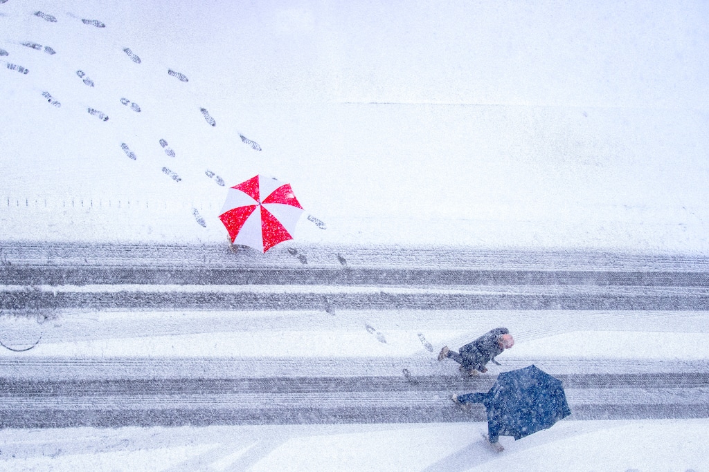 (Rick Egan | The Salt Lake Tribune) Pedestrians brave the snow and wind as they walk down Regent Street in Salt Lake City on Wednesday, Feb. 18, 2026.