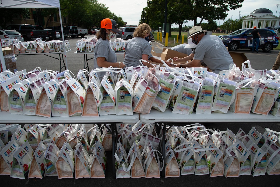 (Francisco Kjolseth  |  The Salt Lake Tribune) The third “Miracle Project” for the nonprofit foundation which raises money to purchase food produced by Utah farmers and then gives to residents in need, takes place at the Utah State Fairpark in Salt Lake City on Monday, July 27, 2020. The food donation from the Utah Farm Bureau’s “Farmers Feeding Utah” program provided food for 600 individuals and families who have recently become unemployed due to the coronavirus.