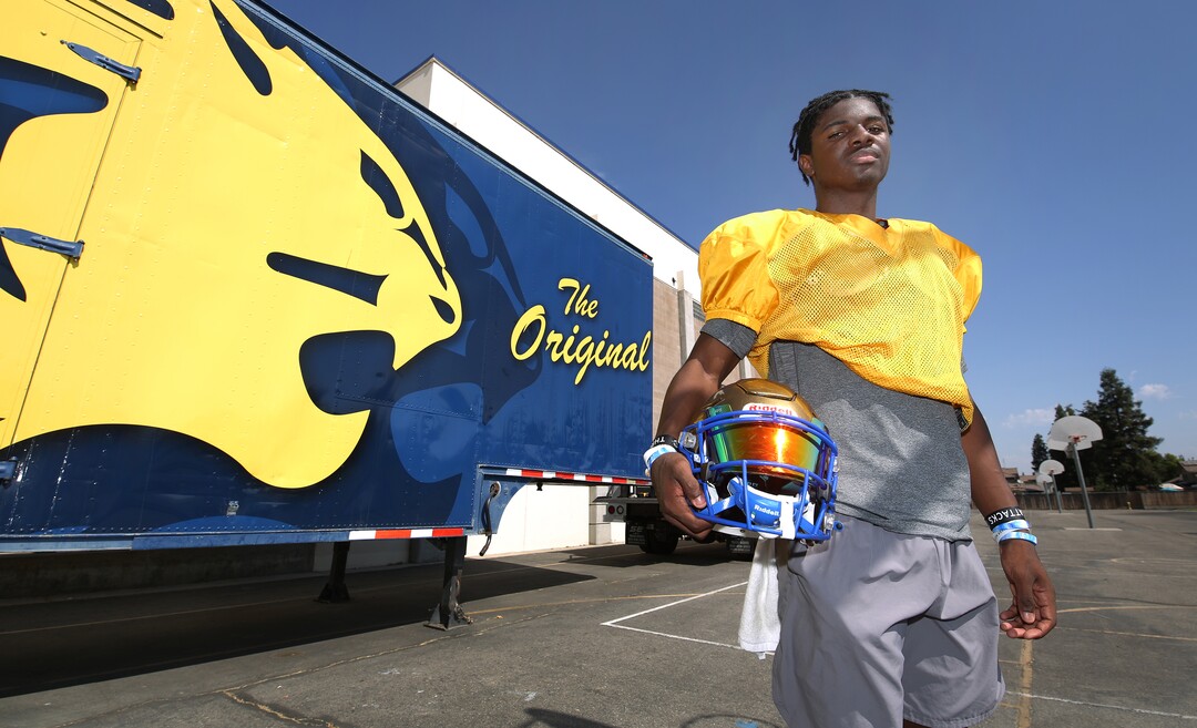 (Gary Kazanjian | Special to The Tribune) Clovis High School quarterback Nate Johnson, who committed to play for the University of Utah, shown on the court near the practive field Wednesday, July 28, 2021, in Clovis, Calif.