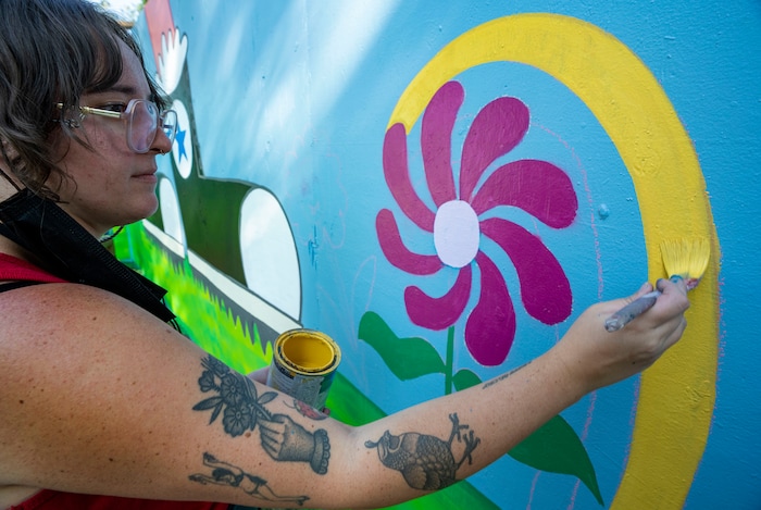 (Rick Egan | The Salt Lake Tribune) Chloe Thomson paints a mural at the Salt Lake Arts Festival, on Saturday, Aug. 28, 2021.