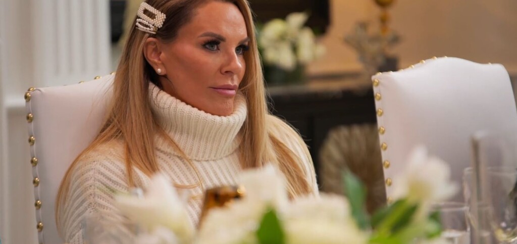 (Bravo) Heather Gay listens to Bronwyn Newport during Mary Cosby's "Breakfast at Tiffany's"-themed brunch, in an episode of "The Real Housewives of Salt Lake City."
