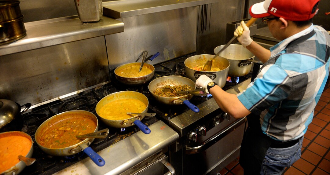 (Al Hartmann  |  The Salt Lake Tribune) 	Chef Binod Lohomi works to prepare several dishes for the lunch buffet at Bhutan House in Sandy. 