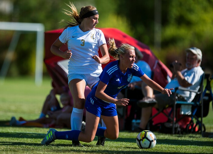 (Chris Detrick | The Salt Lake Tribune) Davis' Maddie McLeod (3) fouls Fremont's Sarah Seaich (4) during the game at Angel Street Soccer Complex in Kaysville Thursday, August 24, 2017. Fremont defeated Davis 5-4 in double overtime.
