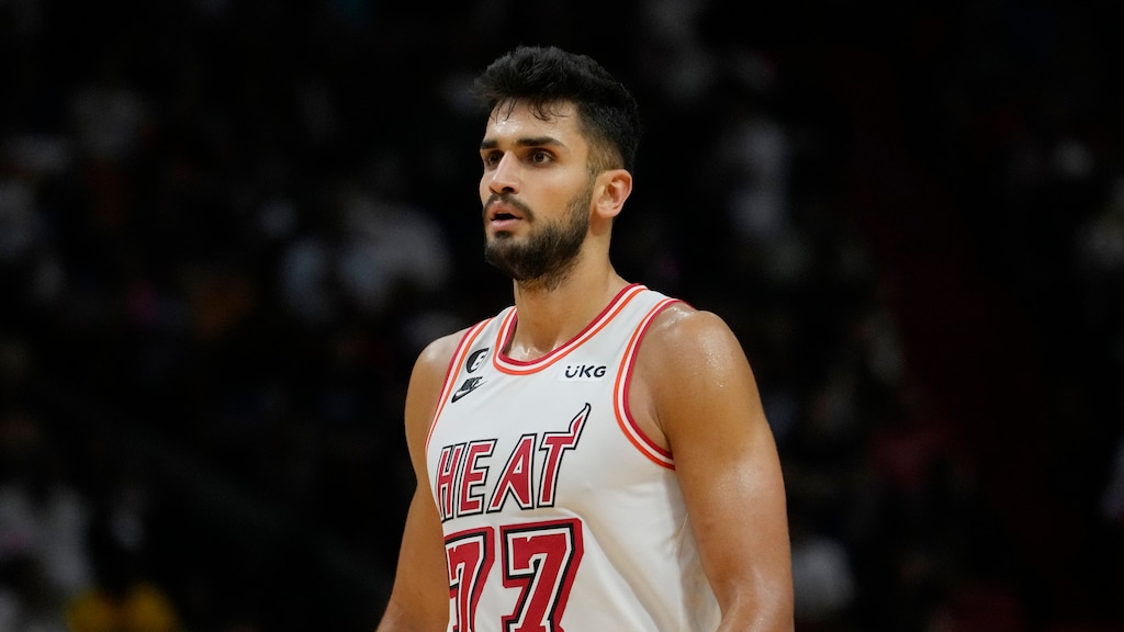 (Lynne Sladky | AP) Miami Heat center Omer Yurtseven stands on the court during the second half of an NBA basketball game against the Orlando Magic, Sunday, April 9, 2023, in Miami. On Monday, the Utah Jazz announced they had signed the free agent big man.