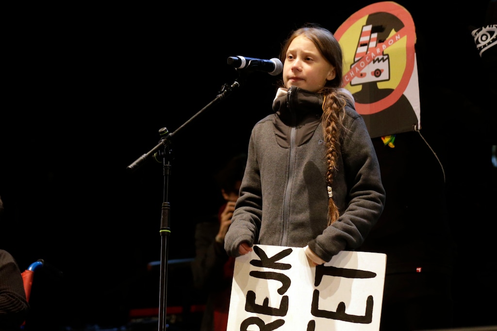(Andrea Comas | AP) Climate activist Greta Thunberg speaks to assistants during a demonstration in Madrid on Friday Dec. 6, 2019. Thunberg arrived to join thousands of other young people in a march to demand world leaders take real action against climate change.