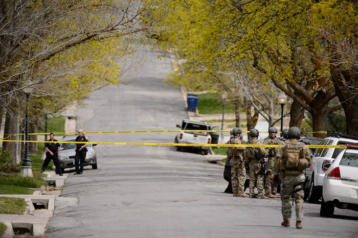 (Trent Nelson | The Salt Lake Tribune)  
Law enforcement at the scene after an incident where a man barricaded himself in a house on Princeton Avenue near 1100 East in Salt Lake City, Wednesday April 18, 2018.