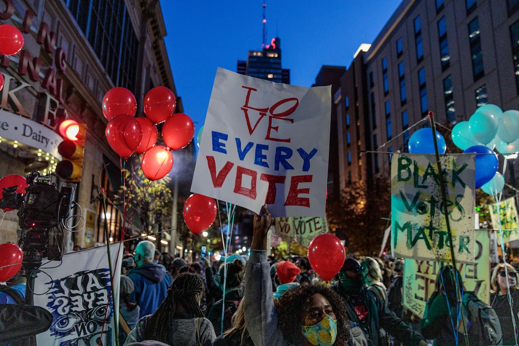 (Damon Winter | The New York Times)  Protesters and revelers gathered outside the Pennsylvania Convention Center Thursday in Philadelphia.