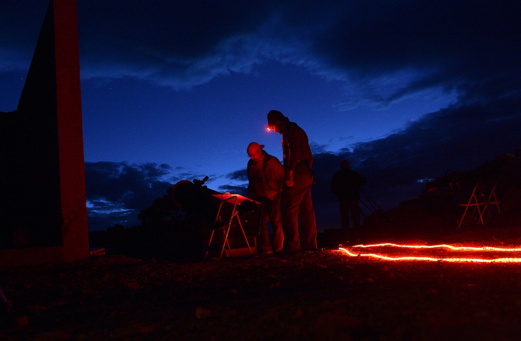 (Leah Hogsten | Tribune file photo)  Torrey residents Darrell Mensel and Tyler Ward set up Ward's telescope during the town's star party October, 19, 2017. Kirsten and Mark Bailey and Mary Beddingfieldsmith held a star party at the Bailey's home to show residents and members of the Wayne County Business Association the beauty of our vast universe, planets and far away galaxies more easily seen in Wayne County's dark skies. In January 2018, Torrey, the gateway town to Capitol Reef National Park, became the state's first Dark Sky Community.