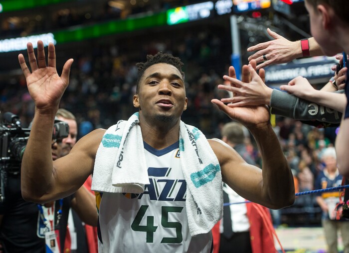 (Rick Egan  |  The Salt Lake Tribune)  Utah Jazz guard Donovan Mitchell (45) is all smiles as he heads to the locker room after the Jazz defeat the Spurs 101-99, in NBA action in Salt Lake City, Monday, February 12, 2018.