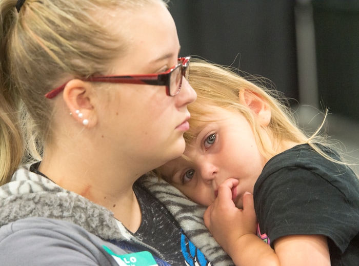 (Rick Egan  |  The Salt Lake Tribune)  Hailey Bartlett and her 3-year-old daughter, Abigail Fletcher, talk to legal help advisers during Project Homeless Connect on Friday, October 6, 2017. The one-day event in Salt Lake City brings together community volunteers to provide services for individuals and families experiencing homelessness.