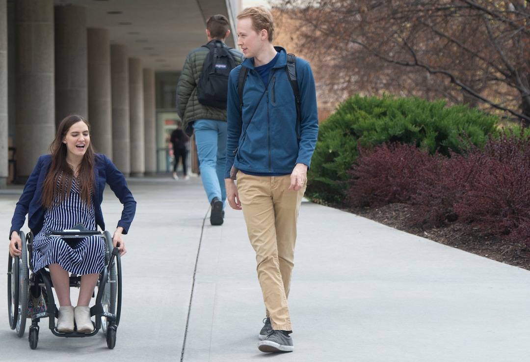 (Rick Egan | The Salt Lake Tribune) Kendra Muller and Topher Taylor take the long way to class, so Kendra can avoid the stairs on BYU campus in Provo. The couple are challenging how BYU accommodates students with disabilities. Wednesday, April 17, 2019.