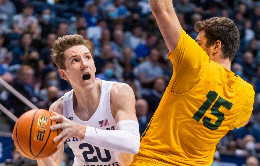 (Rick Egan | The Salt Lake Tribune)  San Francisco Dons guard Gabe Stefanini (15) leans into Brigham Young Cougars guard Spencer Johnson (20) as he goes to the basket, in West Coast Conference action at the Marriott Center in Provo, on Thursday, Feb. 3, 2022.