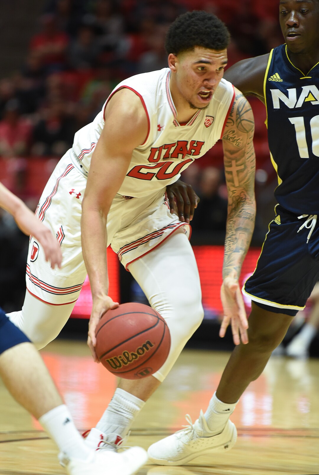 (Francisco Kjolseth  |  The Salt Lake Tribune)  Utah Utes forward Timmy Allen (20) pushes past Northern Arizona during the second half of an NCAA basketball college basketball game at the Jon M. Huntsman Center in Salt Lake City, Ut., Friday Dec. 21, 2018.