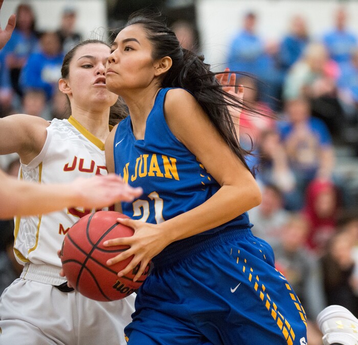 (Rick Egan  |  The Salt Lake Tribune)   Tasiah Little (21) San Juan, takes the ball to the hoop, as Victoria Garcia (40) defends for Judge Memorial, in 3A Women's basketball State playoff action Judge Memorial Vs. San Juan, in Heber City, Friday, Feb. 16, 2018.
