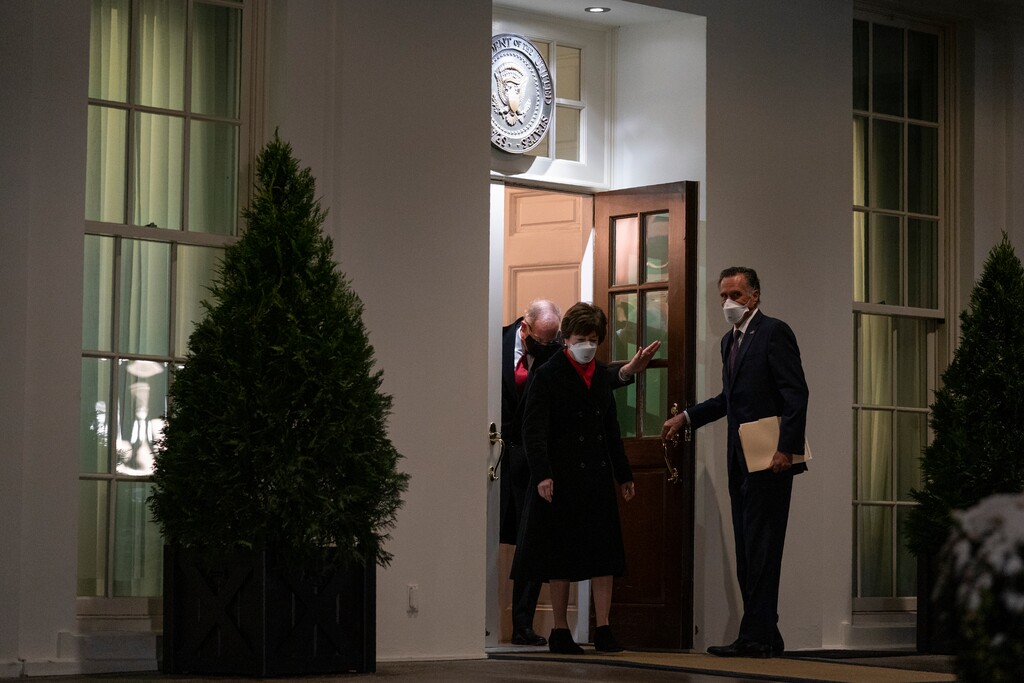 (Evan Viccu | AP) Sen. Mitt Romney, R-Utah, right, holds the door for Sen. Susan Collins, R-Maine, as they walk over to speak to reporters about coronavirus relief negotiations after meeting with President Joe Biden at the White House, Monday, Feb. 1, 2021, in Washington.