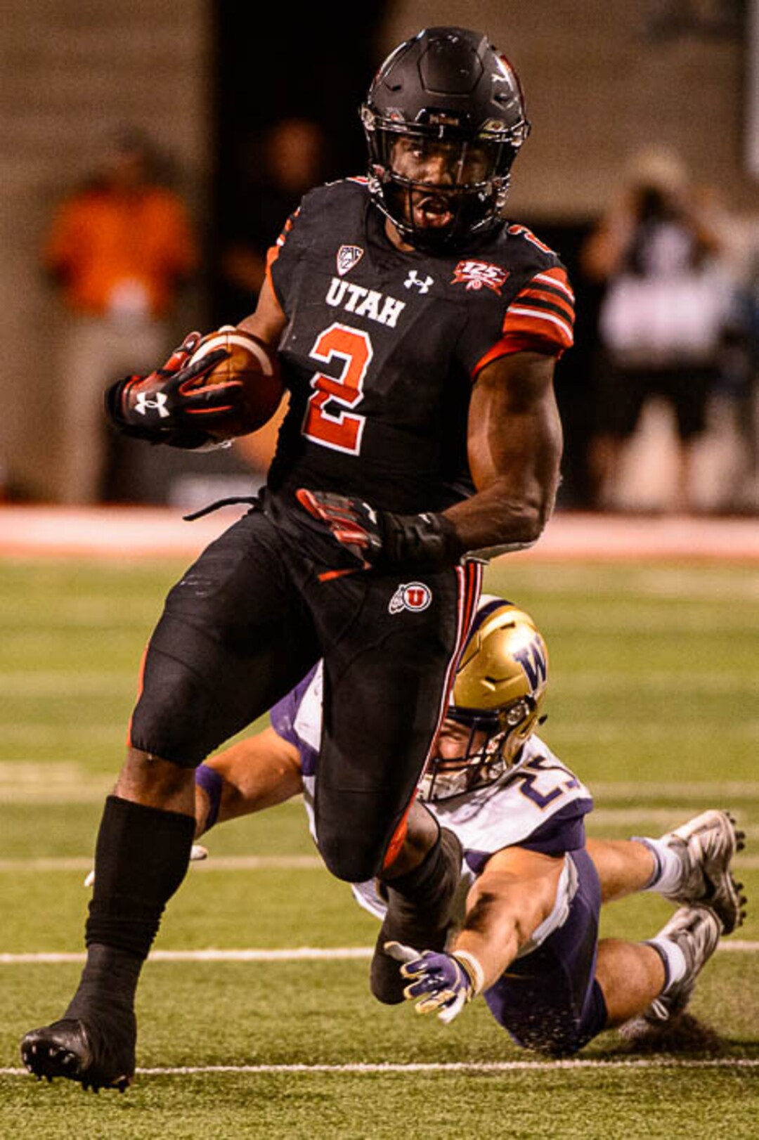 (Trent Nelson | The Salt Lake Tribune)  Utah Utes running back Zack Moss (2) runs the ball as the University of Utah hosts Washington at Rice-Eccles Stadium in Salt Lake City, Saturday Sept. 15, 2018.